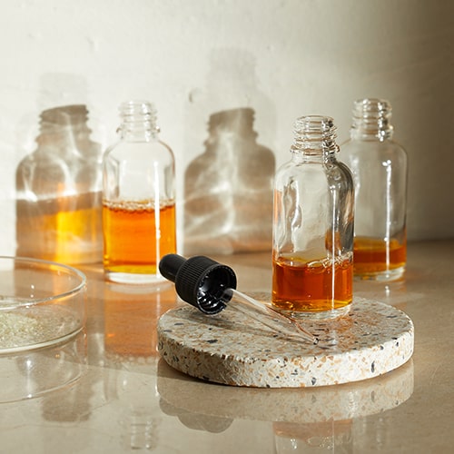 photo of liquid in glass bottles